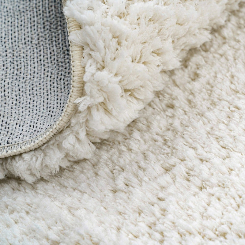 Tapis blanc cassé poils longs en...