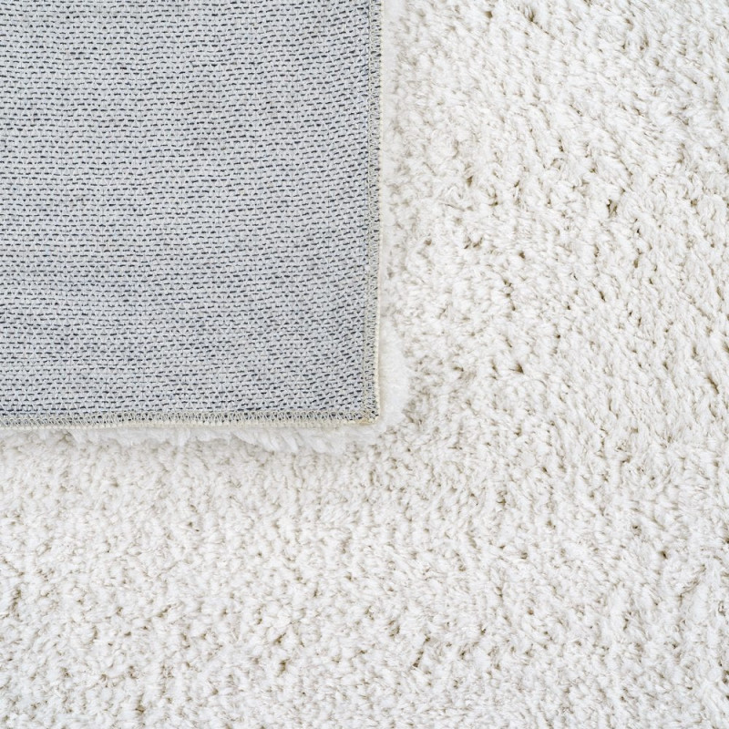 Tapis blanc cassé poils longs en...