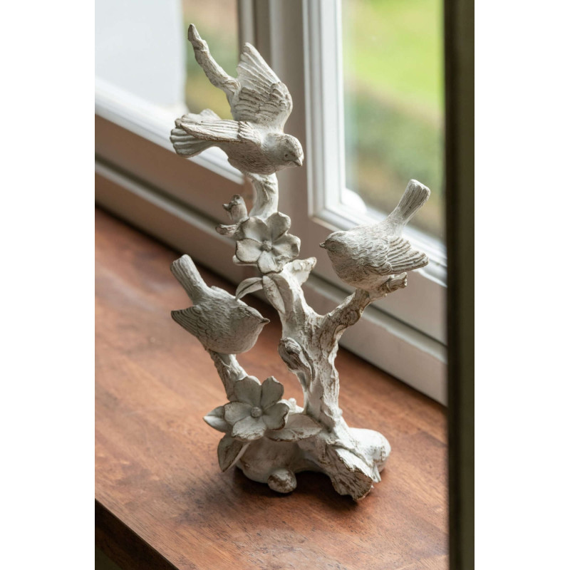 Statue oiseaux sur branche fleurie en...