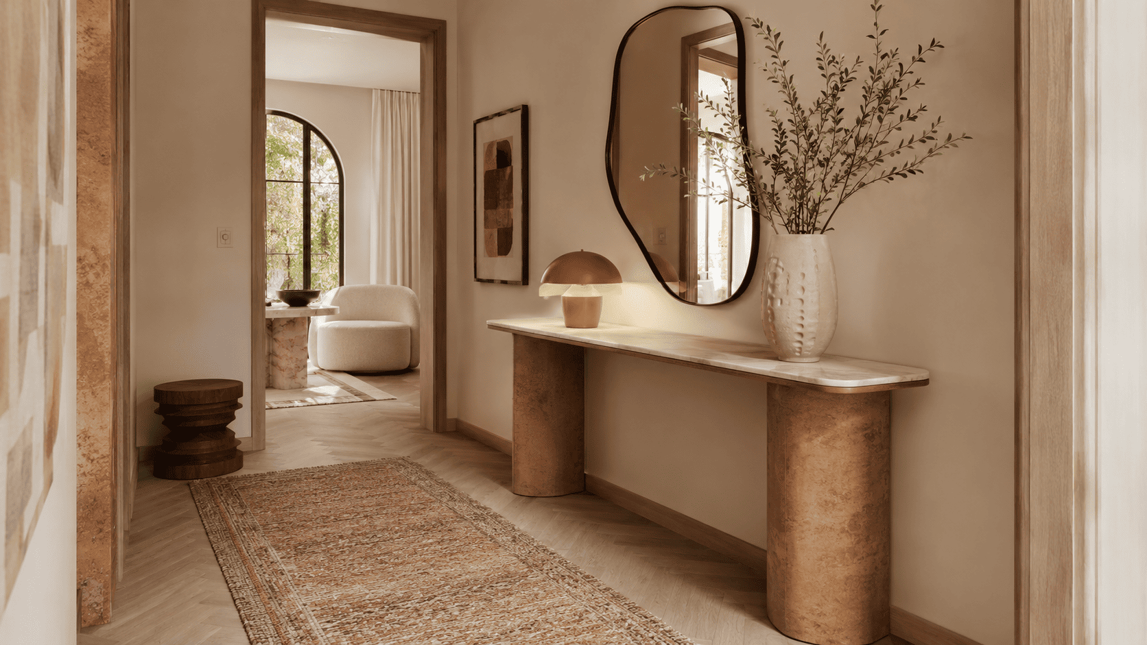 Entrée contemporaine avec console fine, miroir organique, lampe et vase dans une ambiance 2026.