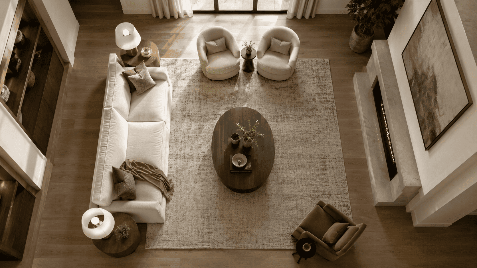 Vue de dessus d’un salon avec canapé, grand tapis et table basse bien dimensionnée au centre.